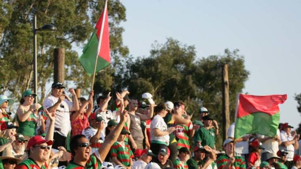 Happy fans &#8230; but the rescue of the South Sydney football club came at a cost.