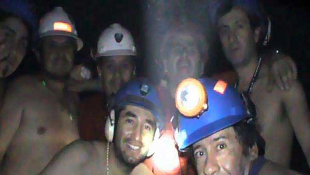 Trapped Chilean miners pose inside the San Jose Mine on Friday.