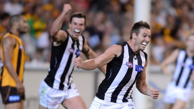Dale Thomas celebrates a goal for Collingwood against Hawthorn in round 1.