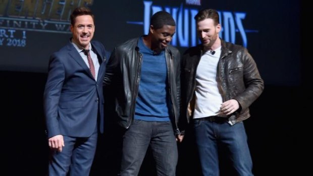 Robert Downey jnr (Iron Man) and Chris Evans (Captain America) welcome Chadwick Boseman, centre, to the Marvel fold. Boseman will have the title role in <i>Black Panther</i>.