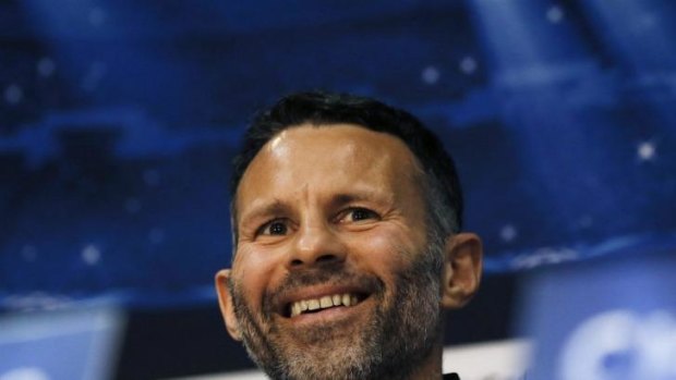 Ryan Giggs is all smiles at the press conference that announced him as Moyes' replacement.