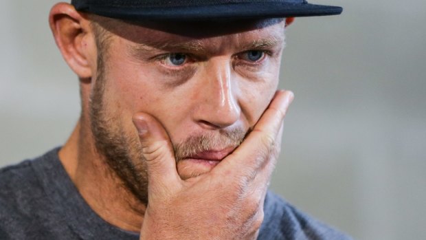 Champion surfer Mick Fanning listens to fellow surfer Julian Wilson's account of events and the moment he survived a shark attack while competing in the final of the J-Bay Open in South Africa on Sunday. 
