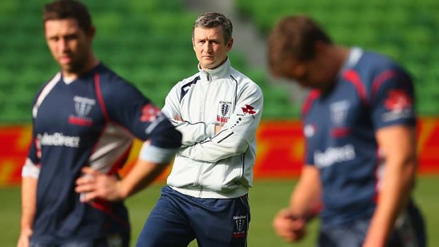 Rebels coach Damien Hill looks on during a captain's run on Monday.