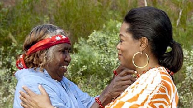 ''Hi, I'm Oprah!'' Winfrey meets an Aboriginal woman in the outback.