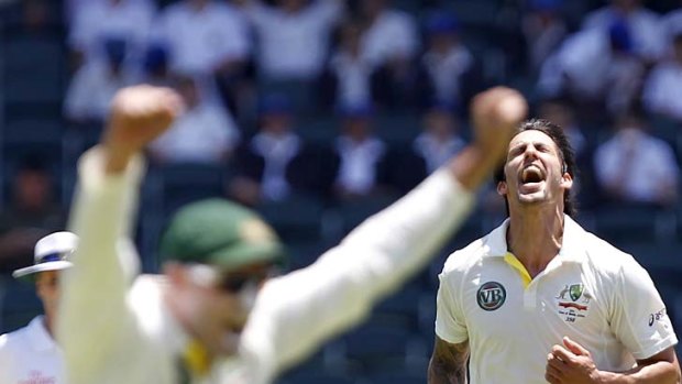 Mitchell Johnson is elated after having South Africa's captain Graeme Smith (not in pic) caught in the slips.