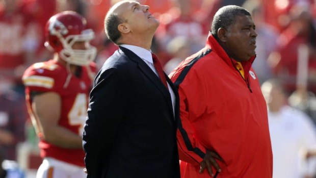 Kansas City Chiefs general manager Scott Pioli, left, and coach Romeo Crennel stand together before the NFL  game against the Carolina Panthers.