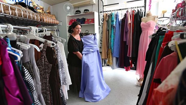 Affordable fashion: Lifeline Liverpool manager Lisa Hutton with some of the second-hand formal gowns on sale.