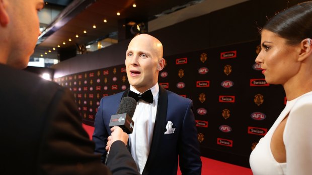 MELBOURNE, AUSTRALIA - SEPTEMBER 28:  Gold Coast footballer Gary Ablett poses for a photo with his partner Jordan Papalia on the red carpet ahead of the 2015 AFL Brownlow Medal count at Crown Palladium on September 28, 2015 in Melbourne, Australia.  (Photo by Pat Scala/Fairfax Media)