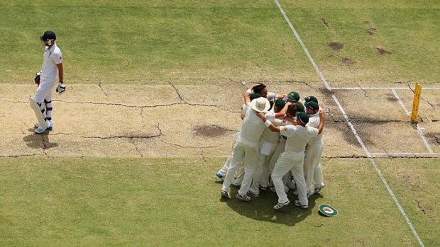 The moment ... The Australians come together after securing the final wicket of James Anderson.