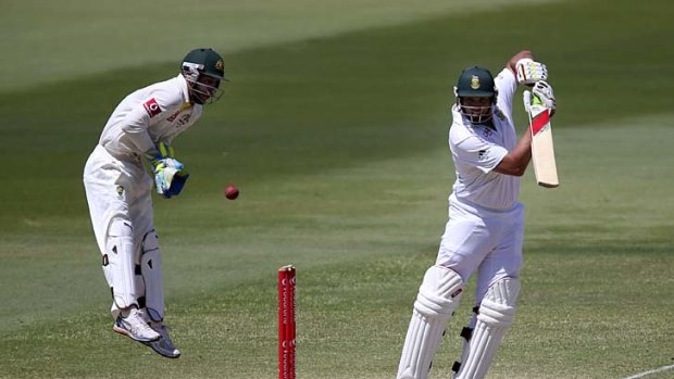 Stay low, stay low: Matthew Wade jumps as he keeps in the second Test against South Africa.