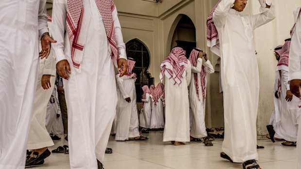 Men leave a mosque after prayers in Riyadh, in ultraconservative Saudi Arabia.