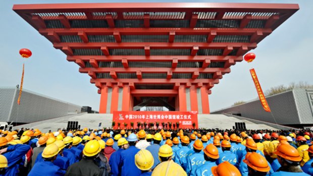 Workers at the completion ceremony of the Chinese pavilion at the site of the World Expo 2010 in Shanghai.