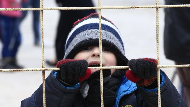 This child at the Turkish borderon near Kilis is among 11 million Syrians who have been forced to flee their homes.