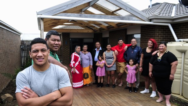 Patrick Mago with his father Pele and extended family in Macgregor.