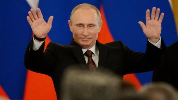 'Crystal clear': Vladimir Putin after signing the 'reunification' treaty.