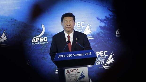 Confident: Chinese President Xi Jinping delivers his keynote address at the Asia-Pacific Economic Cooperation (APEC) CEO Summit in Bali, Indonesia.
