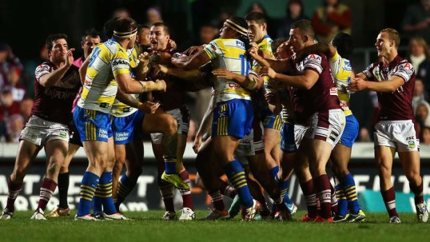 Fisticuffs: players rush in after Eels prop Mitchell Allgood, left, punches Steve Matai.