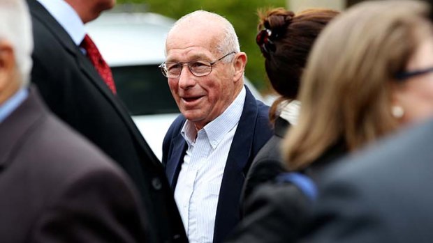 Defiant: Roger Rogerson at the funeral.