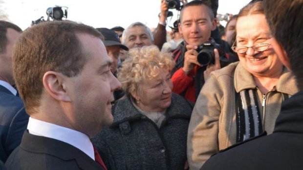 Russian Prime Minister Dmitry Medvedev, left, speaks to locals in Sevastopol.