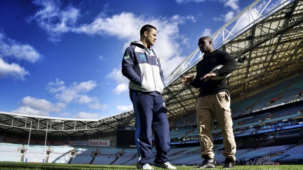 First contact: Jarryd Hayne and Reggie Bush at ANZ Stadium last year.