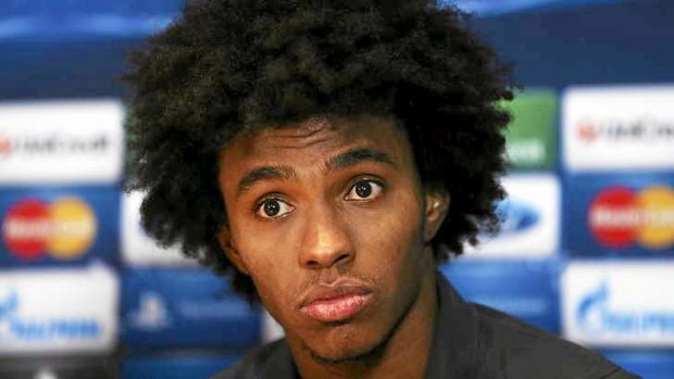 Torn: Brazilian midfielder Willian looked to be headed to Tottenham Hotspur before an eleventh hour bid from Chelsea.