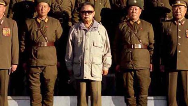 This undated picture, a cropped version of the original image released by the Korean Central Agency, allegedly shows North Korean leader Kim Jong Il posing with soldiers of Korean People's Army unit 2200 at undisclosed place in North Korea.