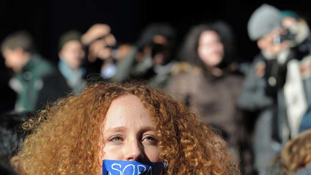 Resistance ... Nadine Wolf wears tape over her mouth as she joins a protest by the technology organisation New York Tech Meetup against proposed laws to curb internet piracy.