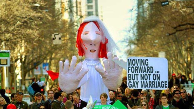 About 600 protesters march up Collins St in support of gay marriage. Seat of Melbourne candidates Adam Bandt of the Greens and Labor's Cath Bowtell spoke at the rally. <i>Picture: Craig Sillitoe</i>