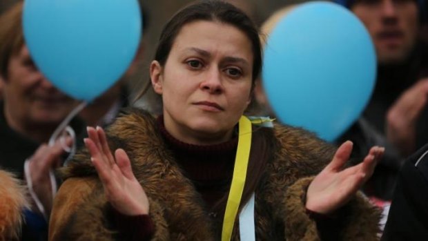 Yula Yavorska listens to speeches at Shevchenko Park during a pro-Ukrainian rally, in Simferopol, Crimea.