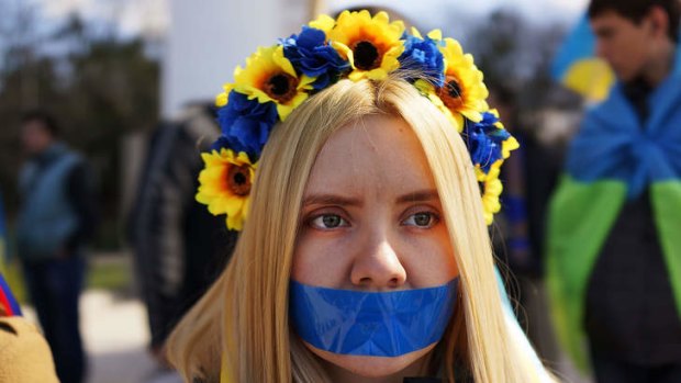 Dissent silenced: Supporters of Ukraine attend a rally in support of keeping Crimea.