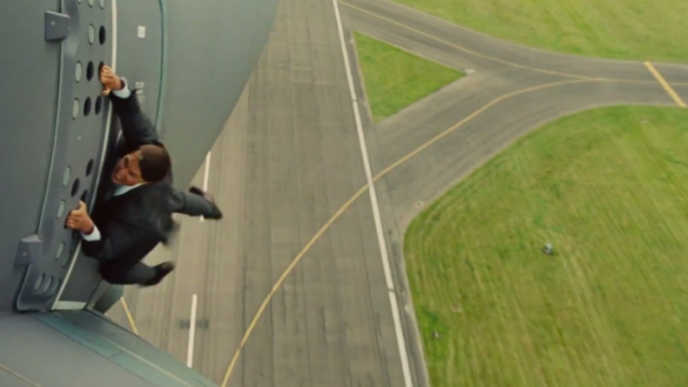 Tom Cruise clinging to the side of a plane for the latest <i>Mission Impossible</i> movie scared him 'shitless'.