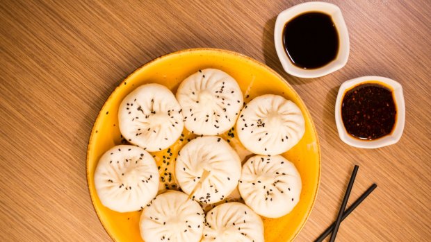 Pan-fried dumplings with black rice vinegar are big, thick-skinned and pork-filled.