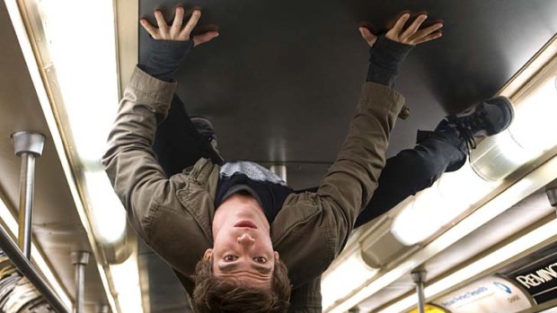 Stick up ... Peter Parker (Andrew Garfield) gives up his seat on the train.