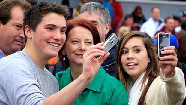 Julia Gillard with amateur photographers at Diamond Creek yesterday.