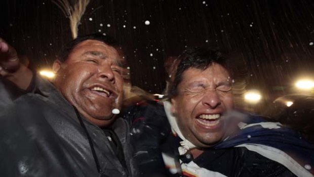 Relatives of miners celebrate after the last miner Luis Urzua was hoisted up to the surface.