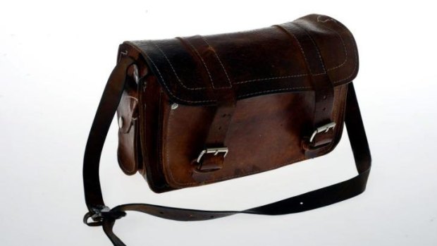 A well-used leather satchel is one of the objects evoking the impact of HIV in Live With It.