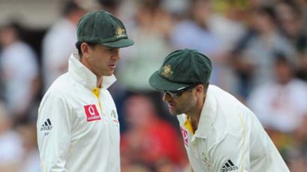 Ricky Ponting and the injured Simon Katich confer.