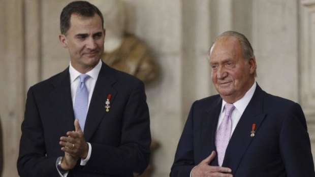 King Felipe (left) and his father, former king Juan Carlos, at the abdication ceremony in June.