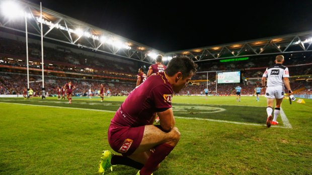 Down, but not quite out: Cooper Cronk takes a knee after the loss.