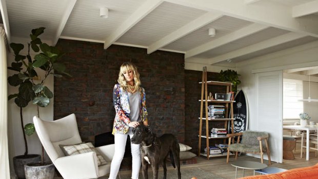 Scandily clad … Simone Haag in the lounge room with Tank, an Irish wolfhound/Great Dane cross.
