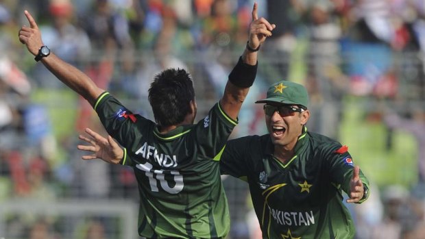 What's not to celebrate? Pakistan cricketer Misbah-ul-Haq (R) embraces captain Shahid Afridi.