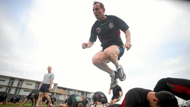 Opposition Leader Tony Abbott goes through an exercise session with troops at Robertson Barracks