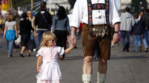 Tradition .. a Bavarian in Lederhosen and his daughter at last year's Oktoberfest.