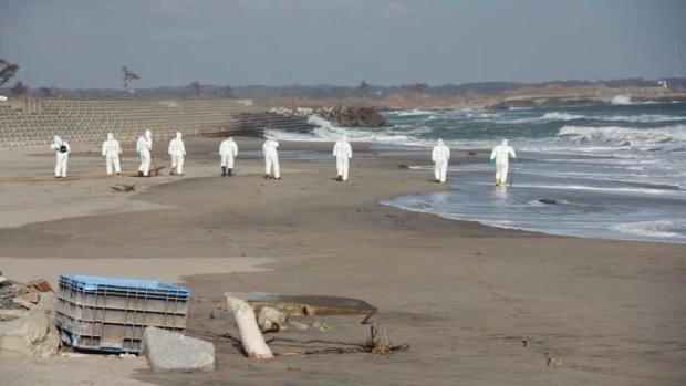 Whatever it takes … police search for missing people on the Fukushima coast.