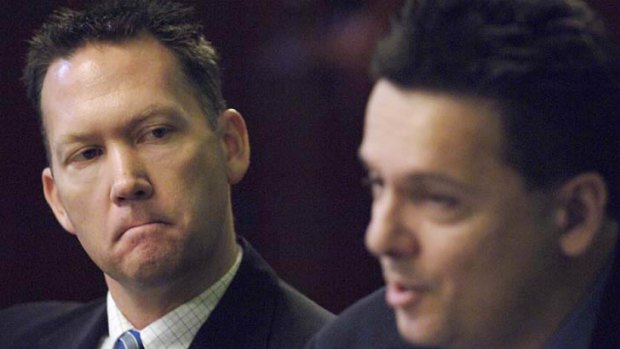 Dennis Hood (from Family first) looks on at Nick Xenophon during debate of the upper house candidates at Old Parliament House Adelaide in 2006.