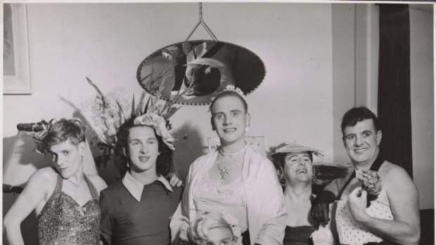 Birds of a feather: Cross-dressing men strike a pose at a house party in the 1950s.