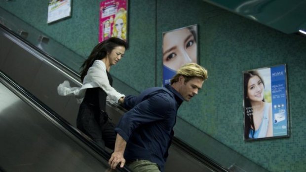 Geeks on the go: Chris Hemsworth and Wei Tang star in Michael Mann's cyber-thriller <i>Blackhat</i>.