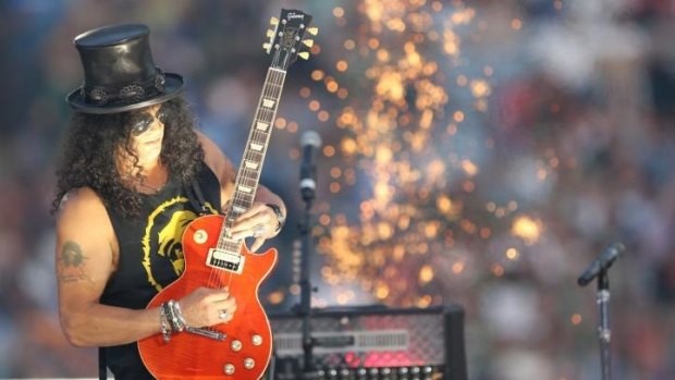 Slash and assorted pyrotechnics (but no band) get the entertainment underway at the NRL grand final.