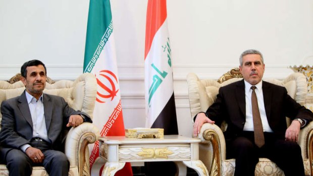 Outgoing Iranian President Mahmoud Ahmadinejad (left) meets with Iraqi Vice-President Khodair al-Khozaei.