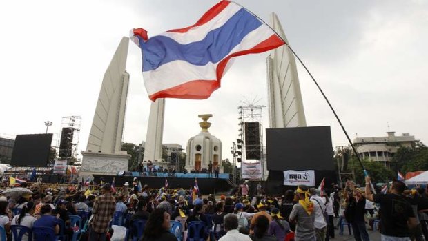 Long haul: Protesters rally against an amnesty bill at the Democracy monument in central Bangkok on Tuesday.